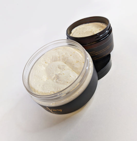 Angled aerial view of the 4oz and 8oz Shea Butter containers are stacked on the 8oz lid.